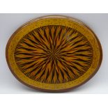 Oval table centrepiece decorated with radiating parquetry design and floral marquetry border W33cm