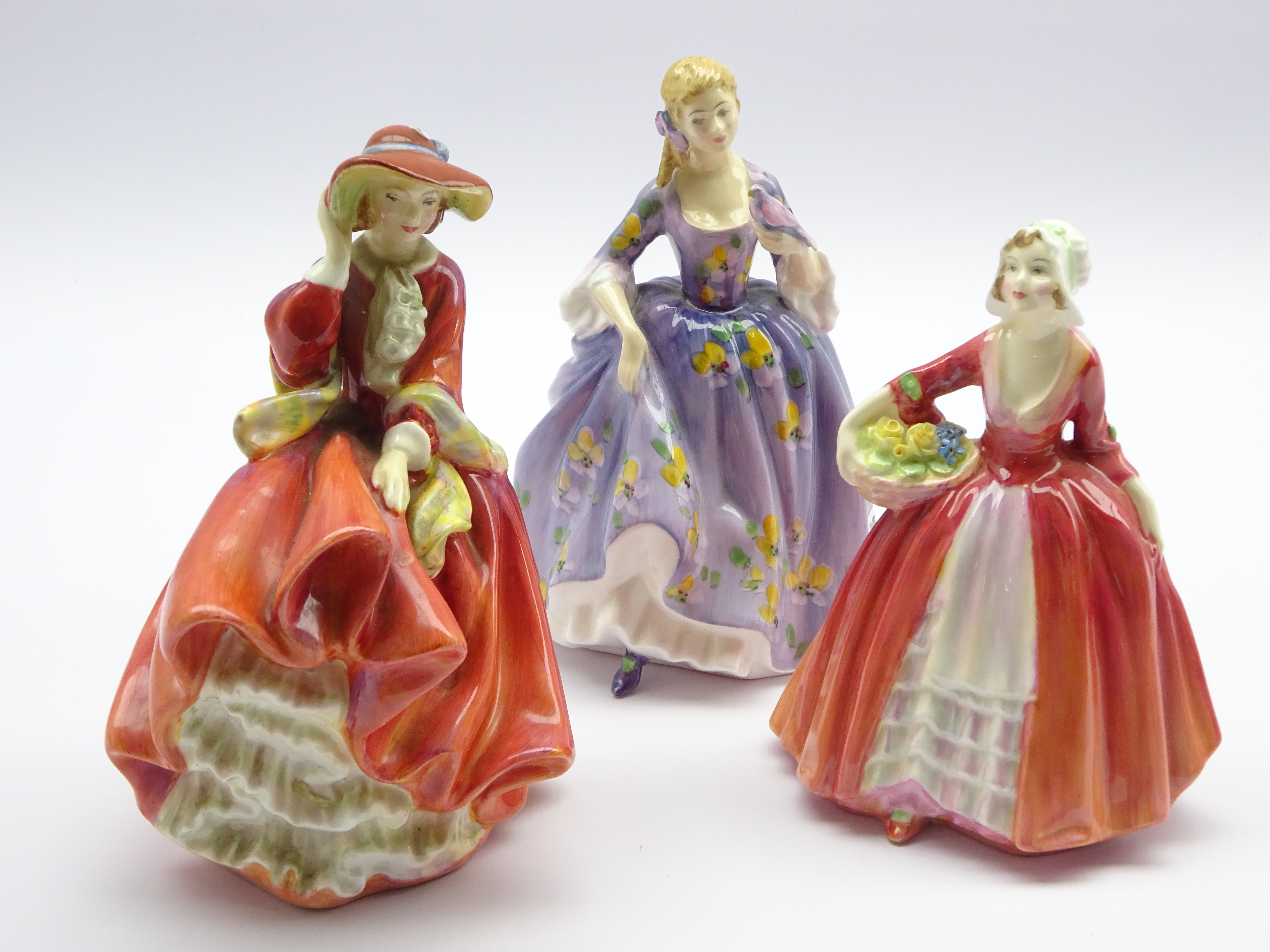 Three Royal Doulton figurines; 'Nicola',