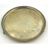 Small silver presentation salver with reeded edge and triple shaped supports, Birmingham 1938,