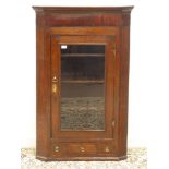 19th century oak and mahogany banded wall hanging corner cabinet, enclosed by single glazed door,