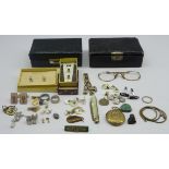 Two small leather jewellery boxes and contents including dress studs, buttons,