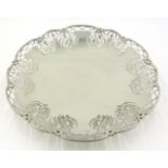 Silver cake stand on low circular pedestal,