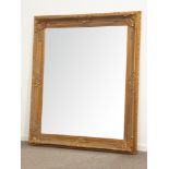 Large rectangular bevelled edge wall mirror in ornate swept gilt frame,