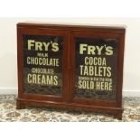 19th century mahogany bookcase enclosed by two glazed doors painted with later 'Fry's Milk