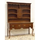 George III oak dresser, two deep drawers above shaped apron on cabriole legs,