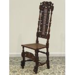17th century walnut high back chair, peacock carved cresting rail with finials,