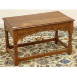 Medium oak coffee table, side rails carved with lunettes, turned supports, 77cm x 42cm,