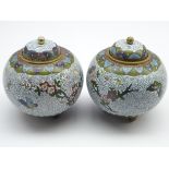 Pair of Japanese cloisonne jars and covers with flowers and insects on a scaled ground H12cm
