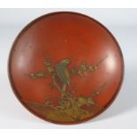 19th Century Japanese red lacquer Sake cup decorated in gilt with birds prunus etc.
