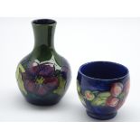 Moorcroft bottle shaped vase in the Clematis pattern,