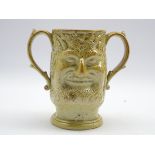 19th century salt glaze jug loving cup, double sided depicting moulded as Bacchus, H18.