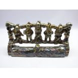 Cast iron fire front, moulded as five Gnomes with a lustre finish,