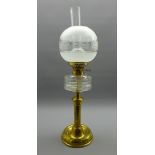 Victorian brass oil lamp with cut glass reservoir, funnel and domed etched glass shade,