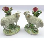Pair of Staffordshire Spill Vases, depicting a standing ram and ewe,