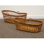 Pair of English wicker graduated oval shaped baskets with carrying handles,