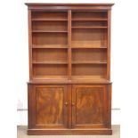 Large Victorian mahogany bookcase on cupboard, projecting cornice over eight adjustable shelves,