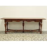 Theodore Alexander - Spanish style cherry wood side table fitted with four frieze drawers,