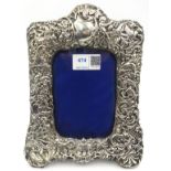 Victorian silver freestanding photograph frame with embossed naturalistic decoration by James