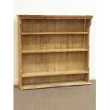 Early 20th century pine four tier open bookcase, W131cm, H123cm,
