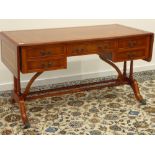 Reproduction yew wood kneehole desk, leather inset top with two drop leaves,