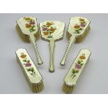 Silver and enamel five piece dressing table set with floral decoration Birmingham 1949,
