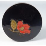 19th Century Japanese lacquered circular box and cover with flower head and leaf decoration,