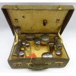 Small travelling toilet case with various glass and silver mounted toilet bottles engraved with a