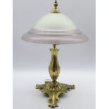 Art Nouveau style table lamp with cast brass base and domed frosted glass shade,
