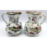 Pair Masons Ironstone panel sided jugs decorated with Japanese landscapes,