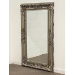 Rectangular bevel edged mirror in silvered swept framed,