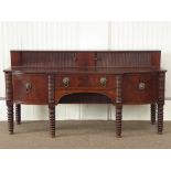 Georgian figured mahogany sideboard, raised back enclosed by tambour roll doors,