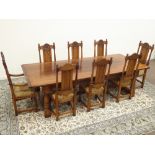 Large oak refectory dining table, rectangular plank top, arcade carved frieze,