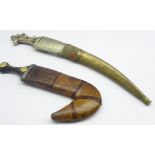 Wahabite jambiya, with curved and etched bade and embossed white metal hilt,