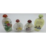 Four glass snuff bottles decorated with Oriental images Condition Report & Further