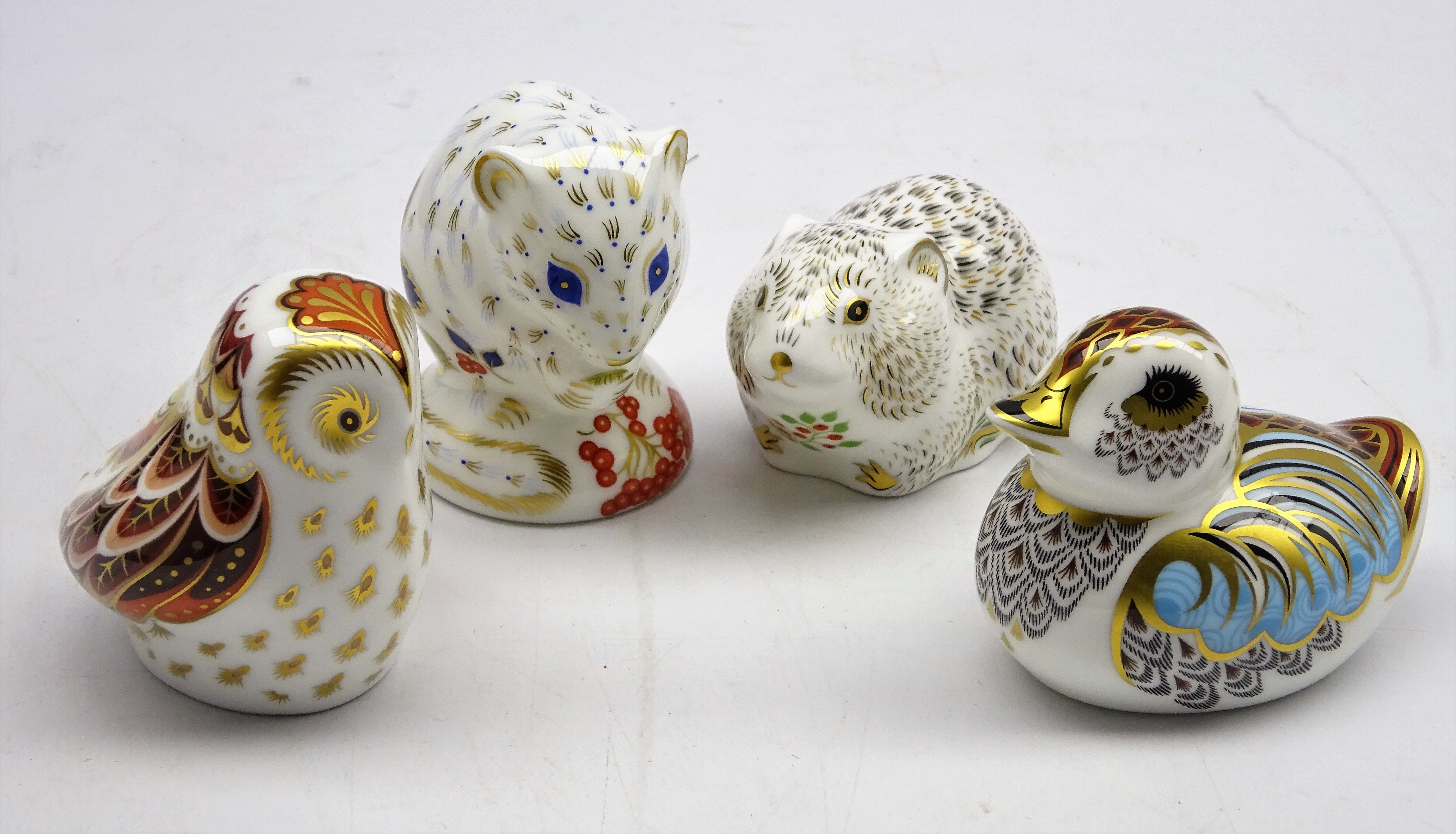 Four Royal Crown Derby Collectors Guild paperweights, 'Owlet', 'Duckling',