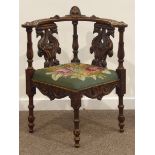 Early 20th century carved beech corner chair, top rail carved with mask and foliage,