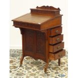 Late Victorian walnut davenport, raised compartment fitted with pen, ink and letter divisions,