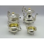 Edwardian four piece silver tea and coffee set of circular design with a floral chased border