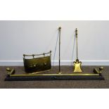 Cast iron and brass fire fender with ball and claw finials, L138cm,