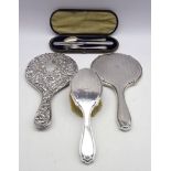 Silver backed hand mirror and matching brush by Walker & Hall,