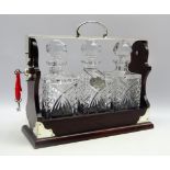 20th century mahogany and polished metal tantalus by Crown and Rose with 3 square glass spirit