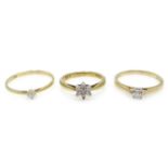 Gold diamond cluster ring and two single stone diamond rings all hallmarked 9ct Condition