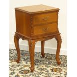 Late 20th century French cherry wood two drawer bedside/lamp table, carved with flower heads,