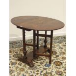 18th century style oak table, pegged oval drop leaf top, gate-leg action base, turned supports,