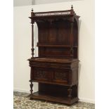 Late Victorian walnut side cabinet, projecting cornice with arched canopy and panelled back,