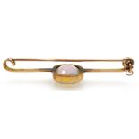 Rose gold bar brooch set with opal,