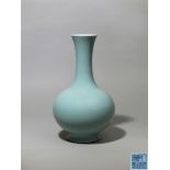 A pale blue Guan-type glazed bottle vase, Qianlong six-character seal mark and of the period