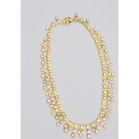 A 18K Yellow Gold and White Sapphire Necklace