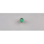 An Oval-shaped Emerald Diamond Ring