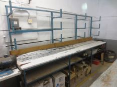 Two sections of steel framed storage racking, with work bench, excludes all stock